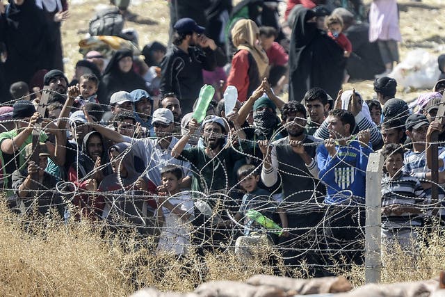 Turkish security forces used water cannon and fired warning shots to push Syrians back from the frontier as thousands massed at a border crossing to escape escalating fighting.  the Turkish border.