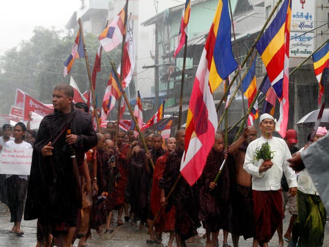 Hard-line Buddhist monks lead a demonstration against Rohingya migrants who were resettled in Rakhine state after being found at sea while fleeing Burma following anti-Muslim violence