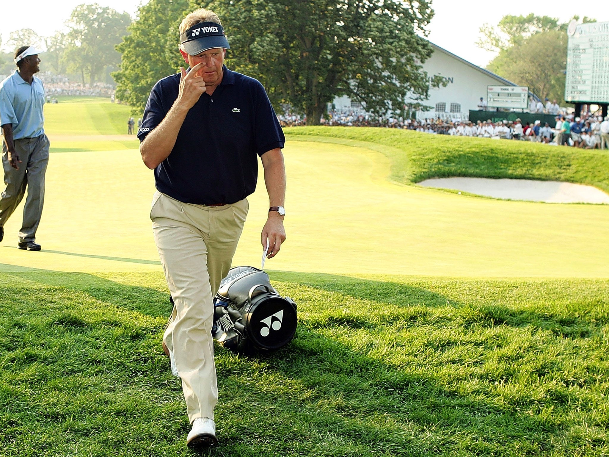 Colin Montgomerie walks off the course after his capitulation at the 2006 US Open at Winged Foot