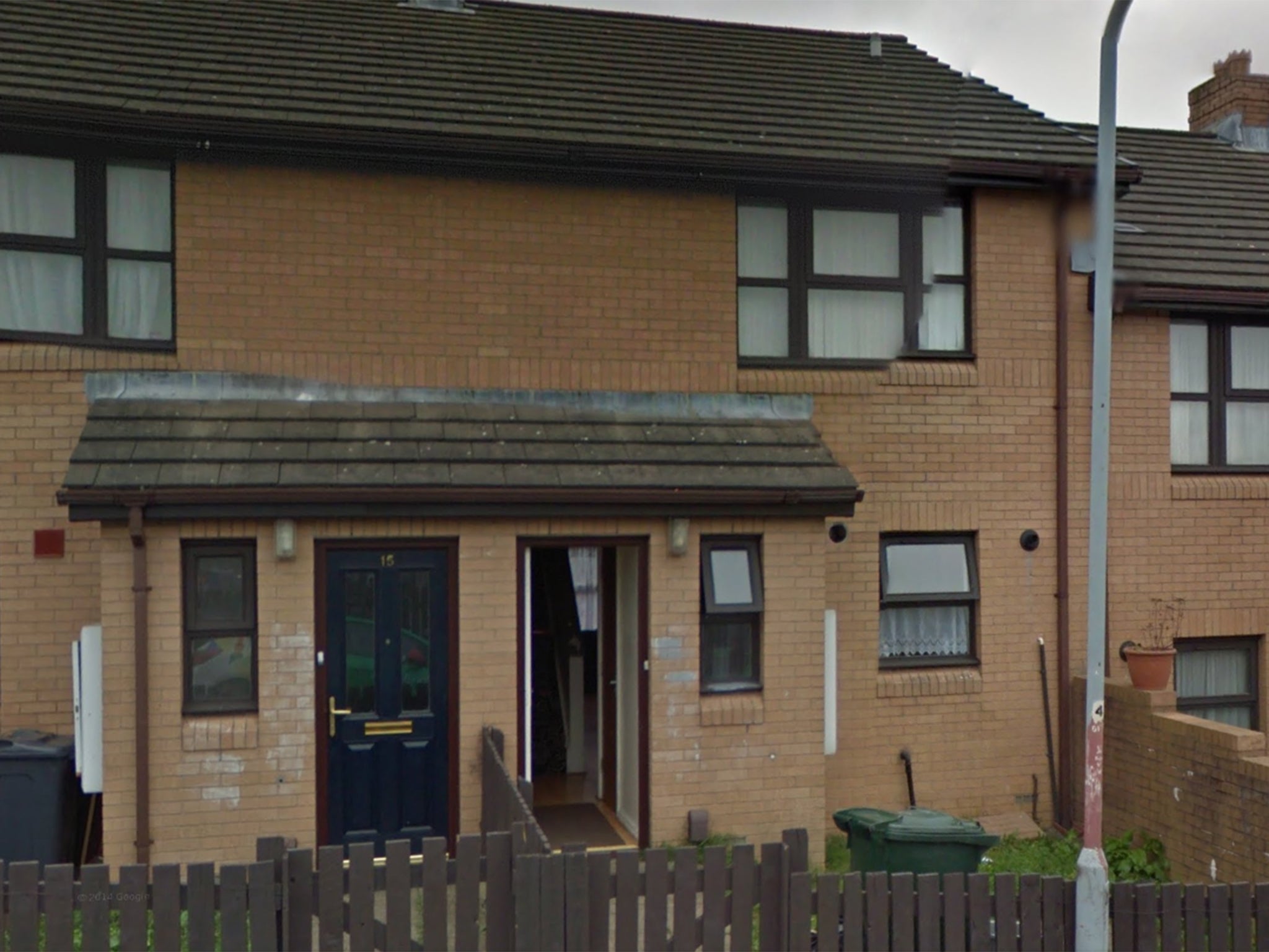 The house (with the front door ajar) where a pregnant woman was found stabbed to death