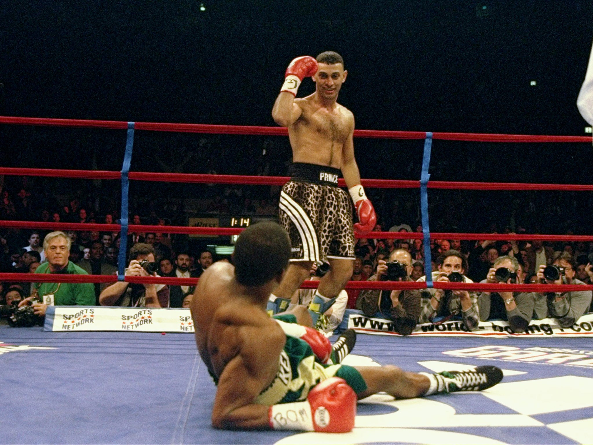 Naseem Hamad stands over a knocked down Kevin Kelley during their fight in 1997