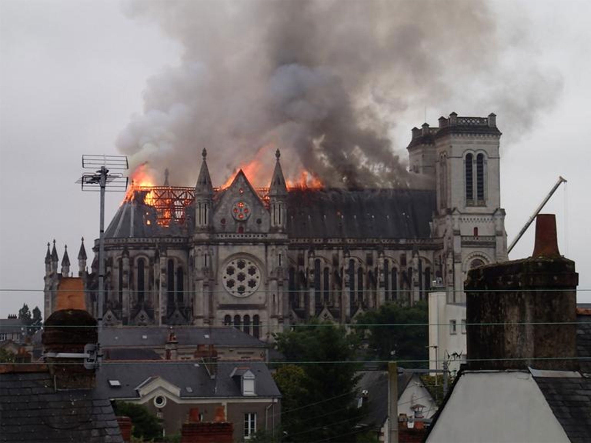 Photos uploaded to social media show the roof of the 19th century basilica burning (credit: Maxime Claval/ Twitter)