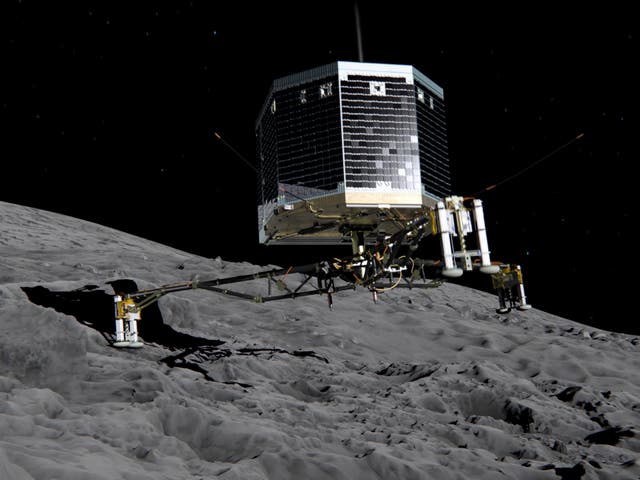 In this February 17, 2014 handout photo illustration provided by the European Space Agency (ESA) the Philae lander is pictured descending onto the 67P/Churyumov-Gerasimenko comet