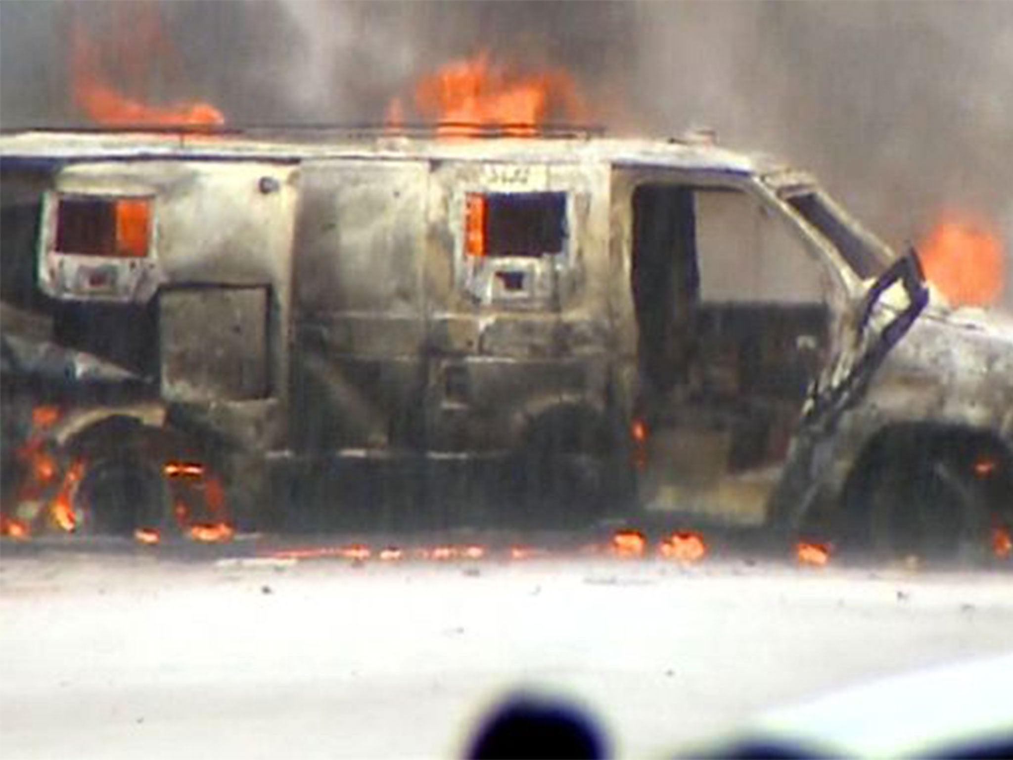 The armoured van was set ablaze after the Dallas stand-off
