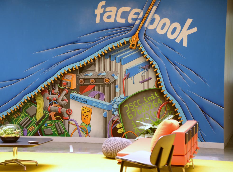 A mural decorates one of the many open space work areas at the Facebook headquarters in Menlo Park, California, May 15, 201
