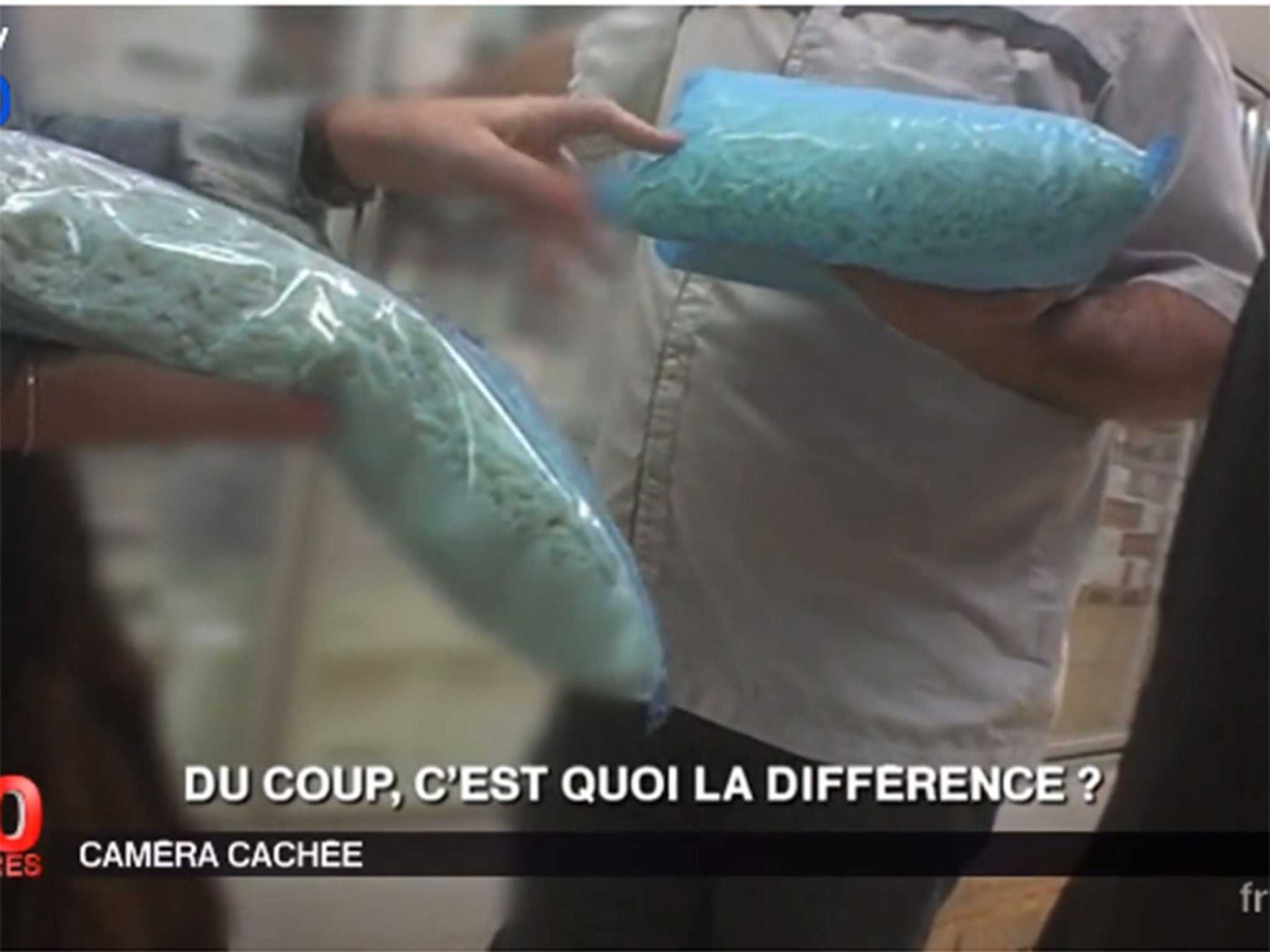 Screengrab from France 2's report showing undercover reporting inside the factory