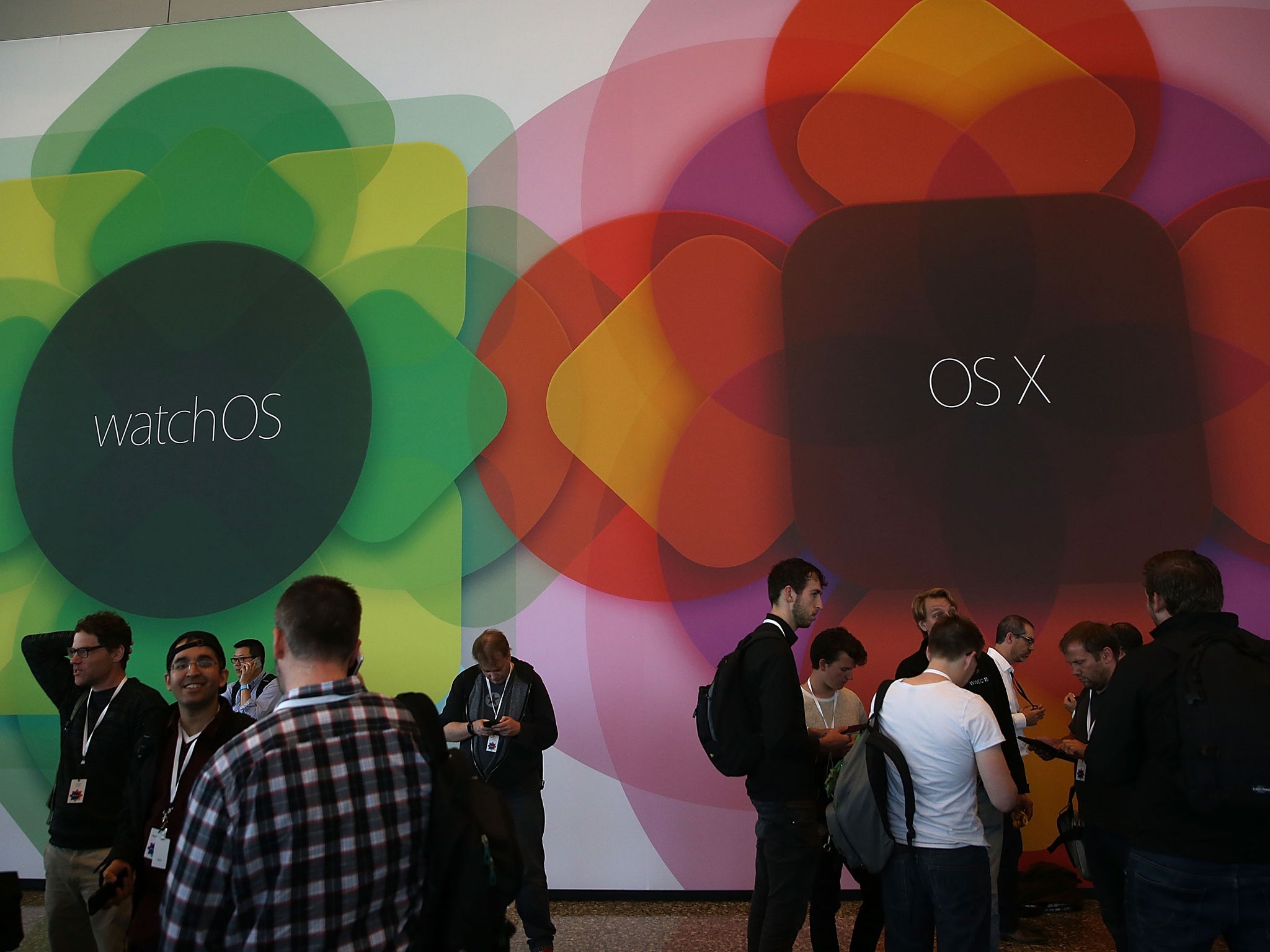 Signs for watchOS and Mac OS — the Apple Watch and Mac operating systems — hang at WWDC, where updates to both were announced