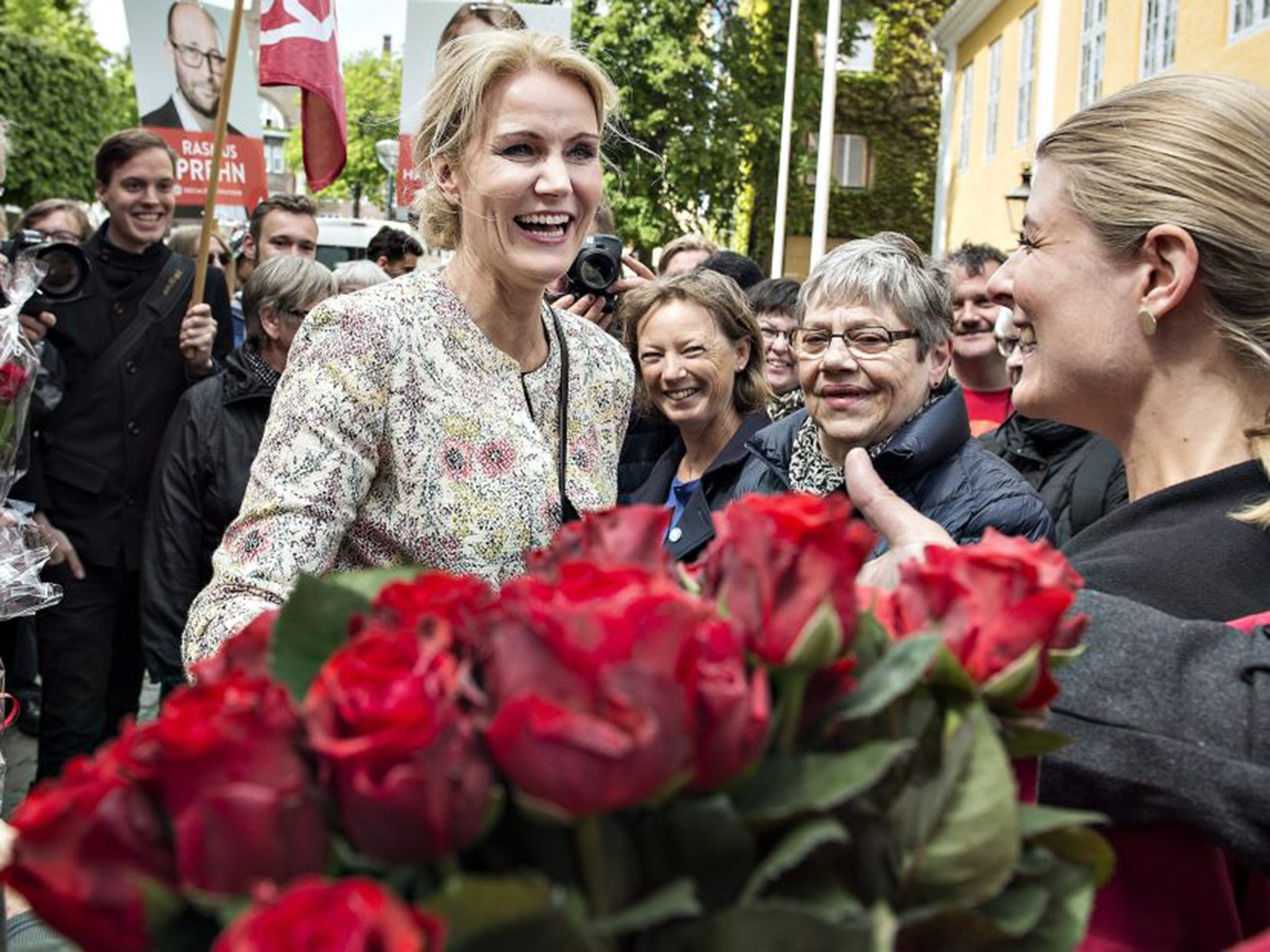 Danish Prime Minister Helle Thorning-Schmidt greets supporters holding red roses, the Social Democratic party’s symbol, at a campaign stop in Aalborg