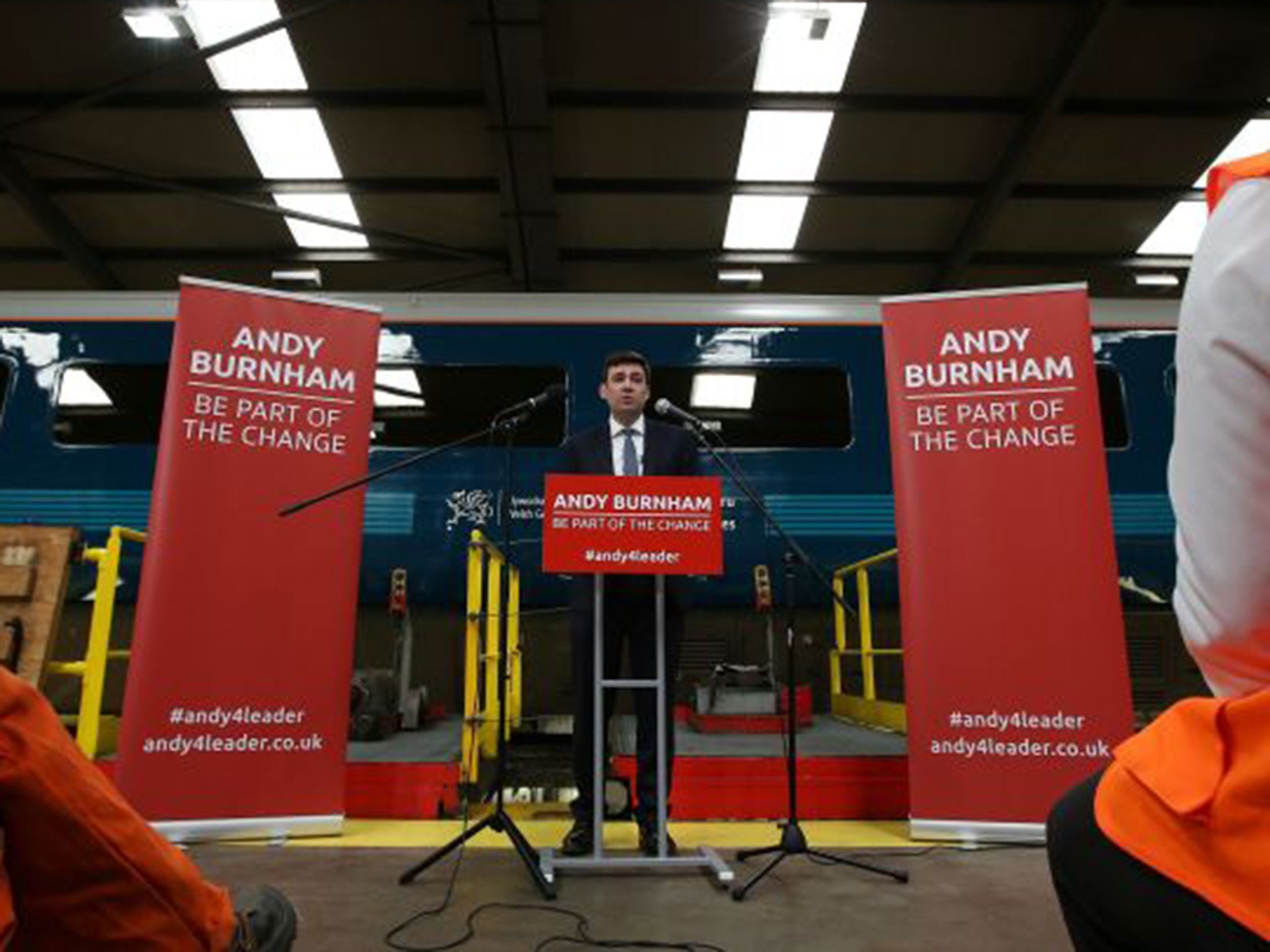 Labour leadership candidate Andy Burnham speaking at Arriva trains in Crewe. Some believe Mr Corbyn’s presence will make it harder for him to pick up votes (