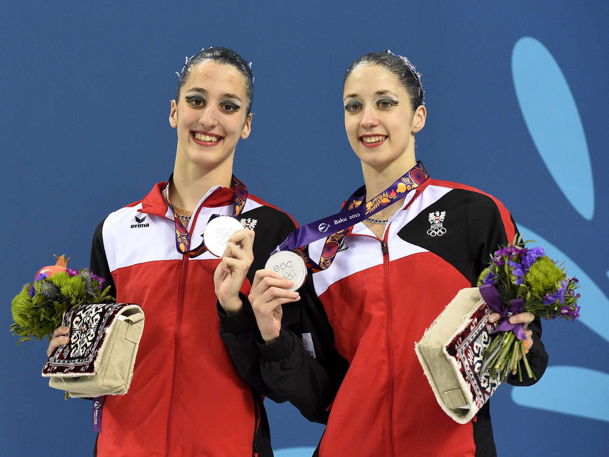 Austria's Anna-Maria Alexandri and Eirini-Marina Alexandri pose with their silver medals after the synchronized swimming duet free routine