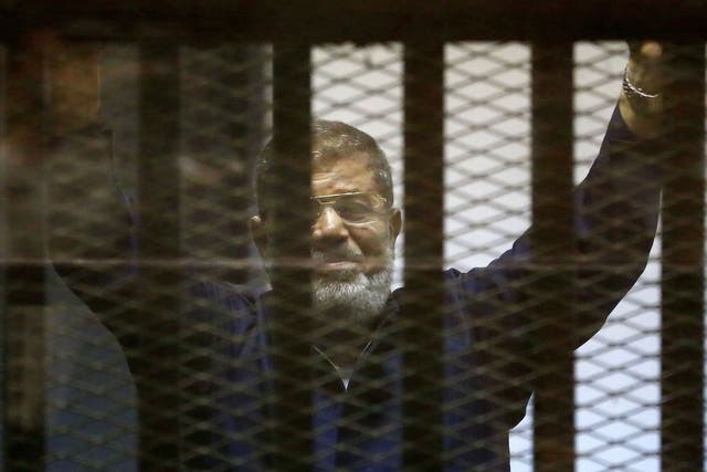 Former Egyptian president Mohamed Morsi in court as he is sentenced to death