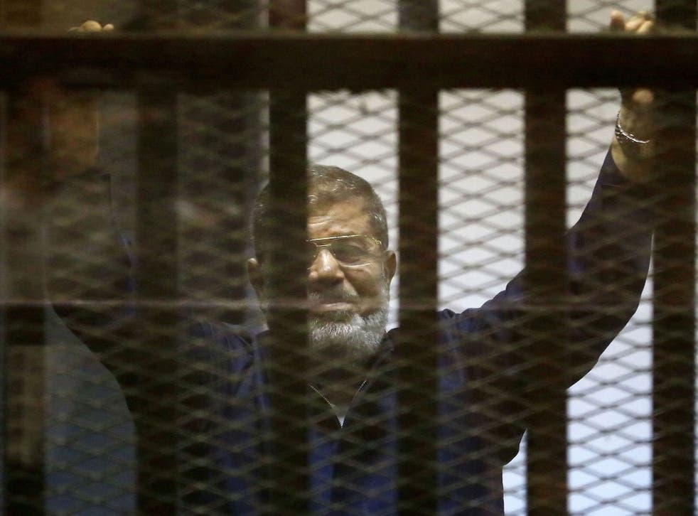 Former Egyptian president Mohamed Morsi in court as he is sentenced to death