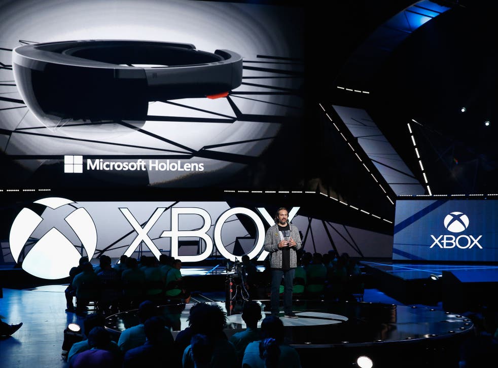 Microsoft corporate vice president, Kudo Tsunoda introduces the Microsoft HoloLens during the Microsoft Xbox E3 press conference at the Galen Center on June 15, 2015 in Los Angeles, California