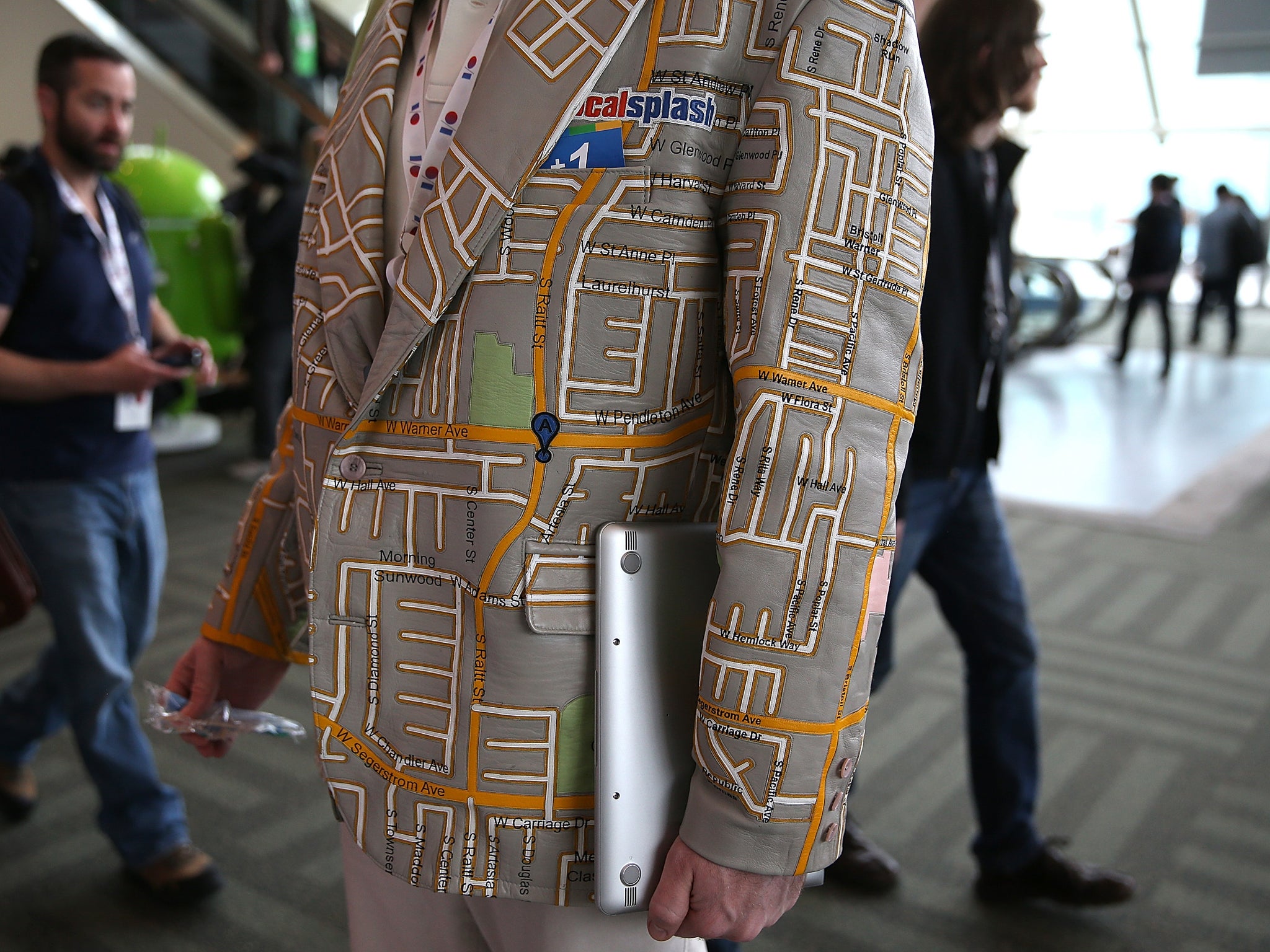 An attendee wears a custom made Google maps leather coat during the Google I/O developers conference at the Moscone Center on May 15, 2013 in San Francisco, California