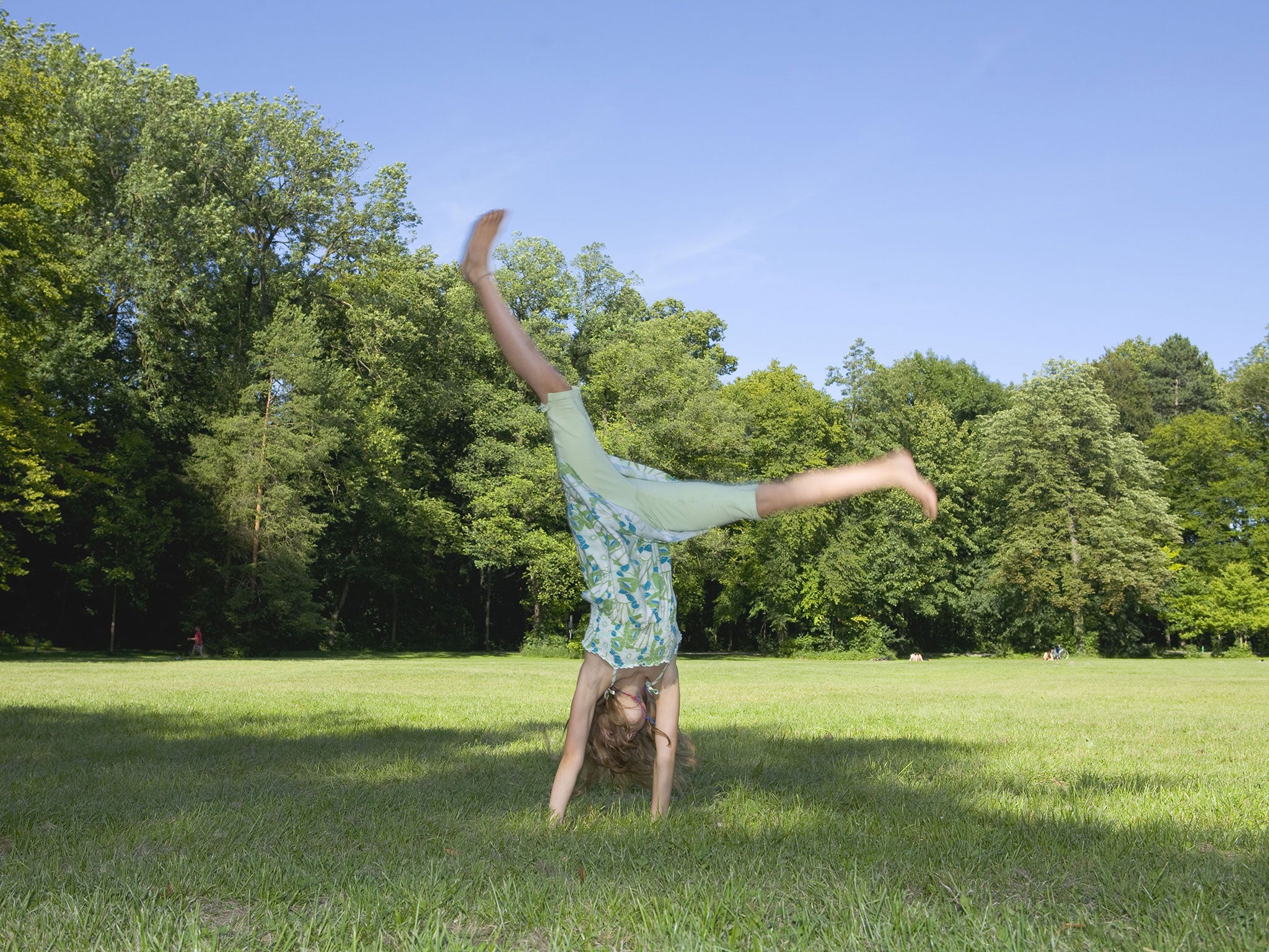 A girl does a cartwheel
