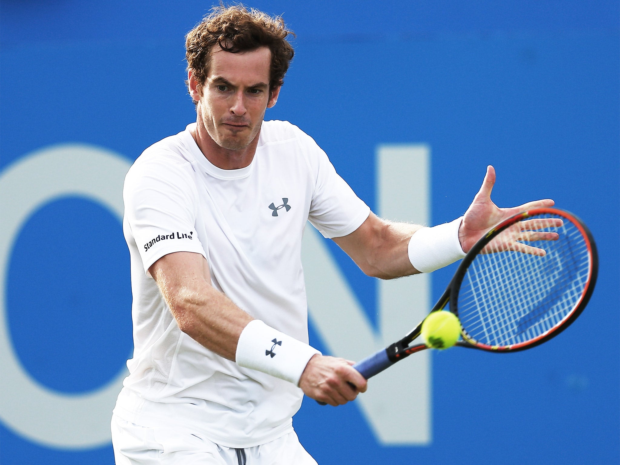Andy Murray plays a backhand during his first-round win over Lu Yen-hsun
