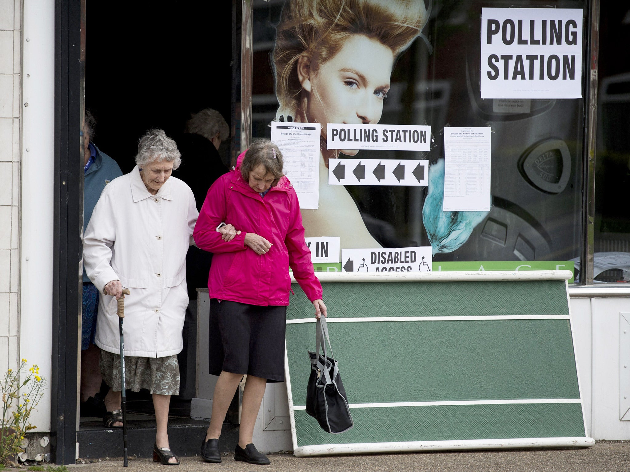 Two elderly voters leave a polling station in Hull, during May's General Election