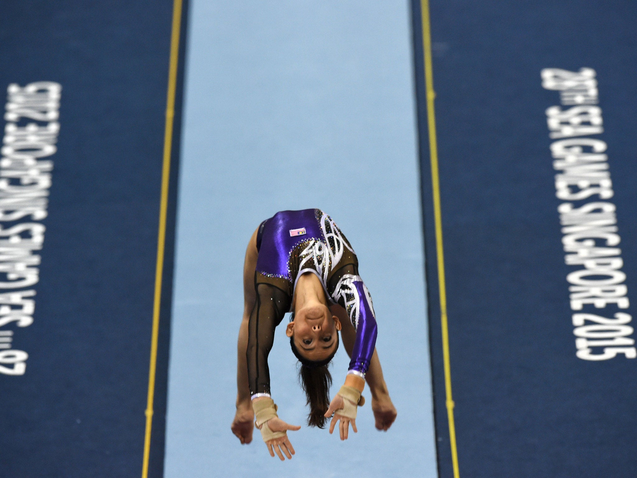 Farah Ann Abdul Hadi competes on the vault during the women's individual all-around gymnastics final at the SEA Games