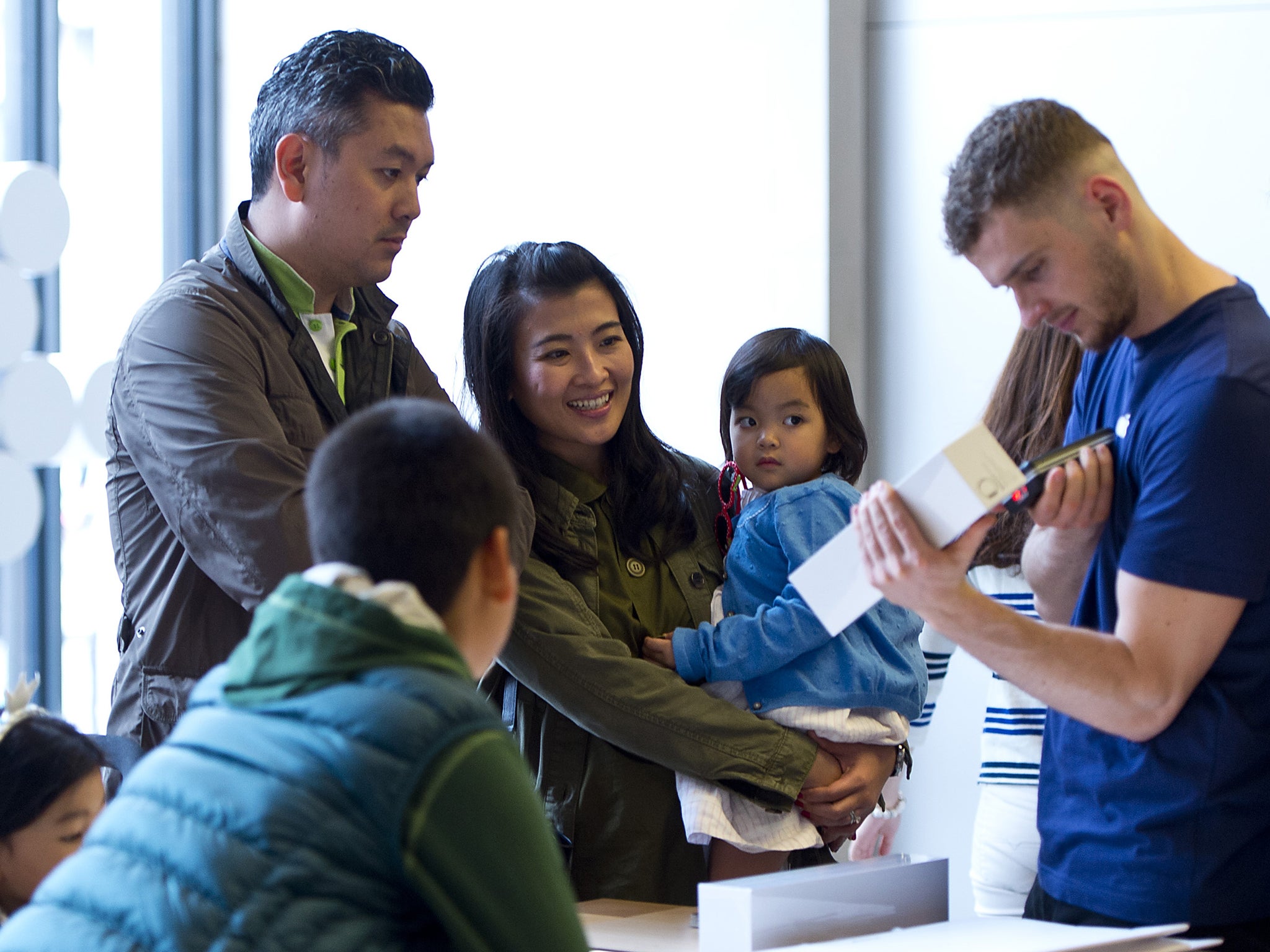 Customers picking up a Watch from the Apple Store