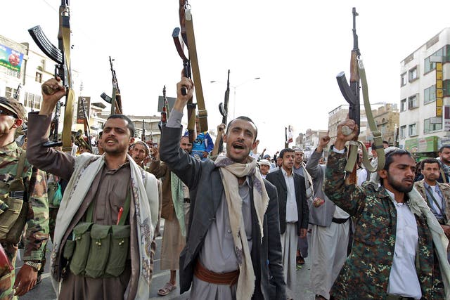 Huthi fighters raise their weapons during a recent rally in Sanaa