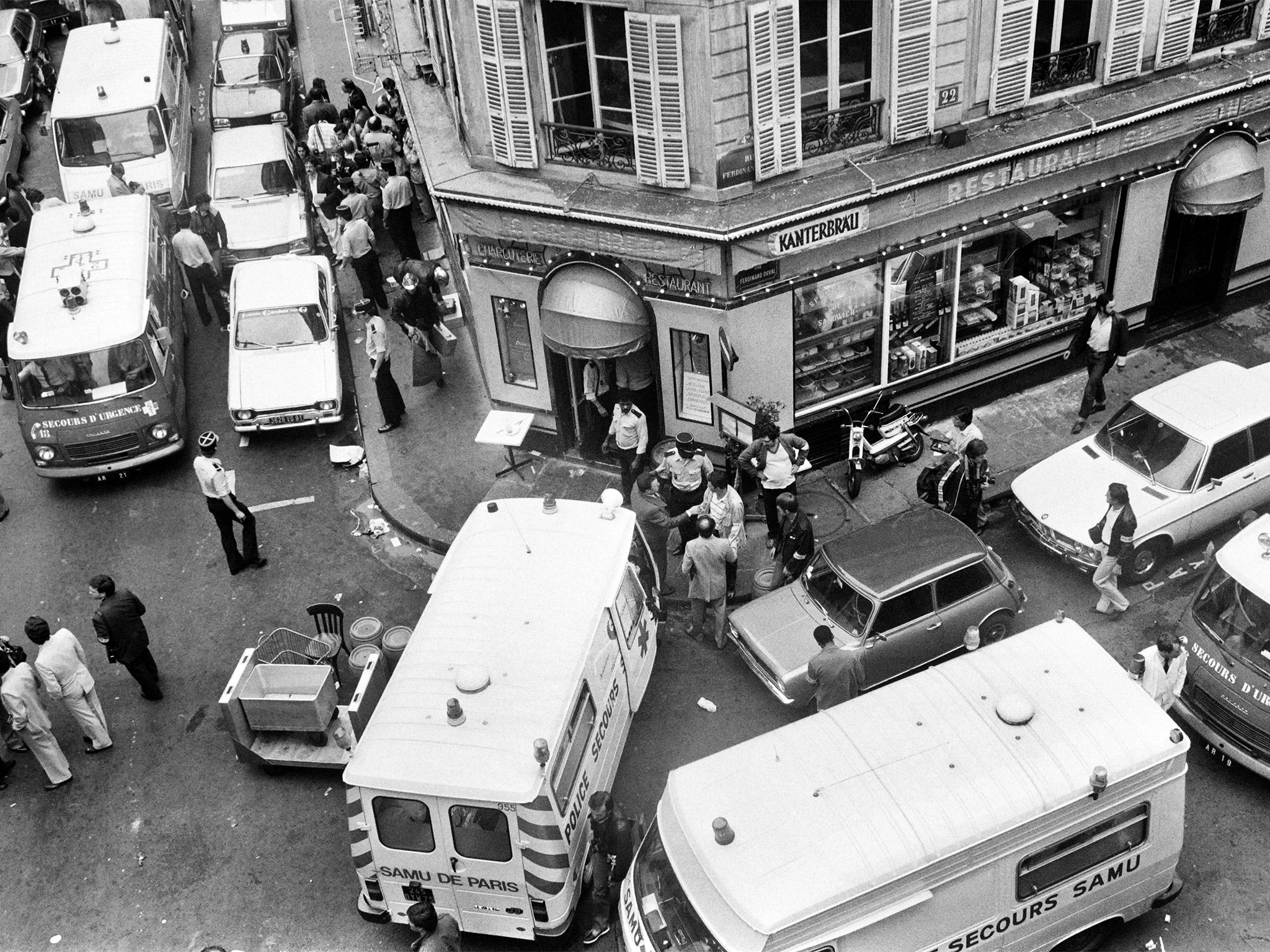 Emergency services vehicles surround Chez Jo Goldenberg during the immediate aftermath of the attack