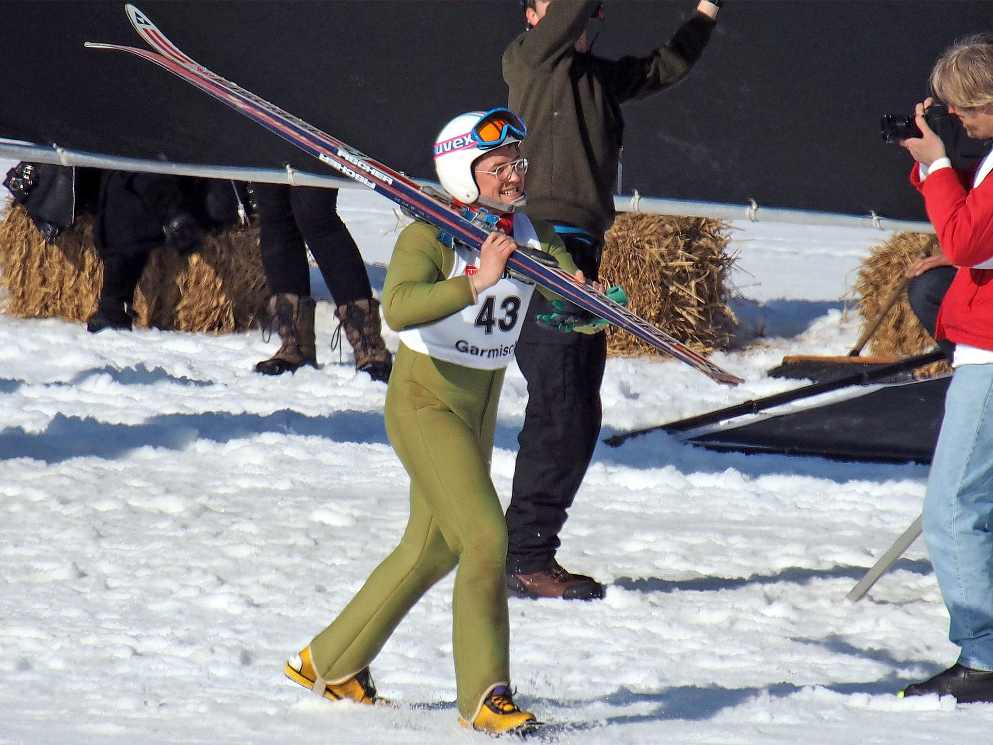 Taron Egerton, on set in Germany, taking to the slopes as glorious Olympic failure Eddie the Eagle (Rex)