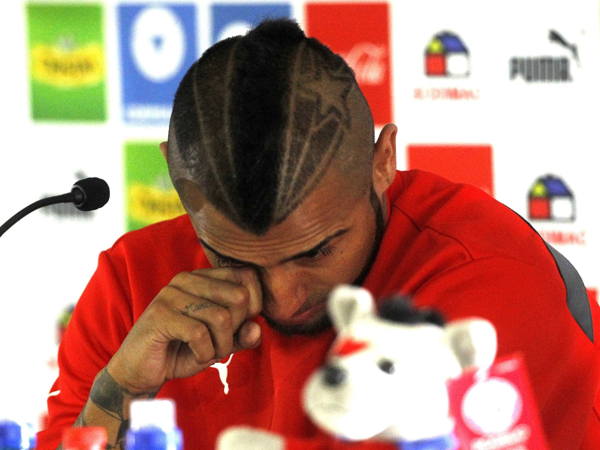 Arturo Vidal cries in a press conference after his arrest for alleged drink driving