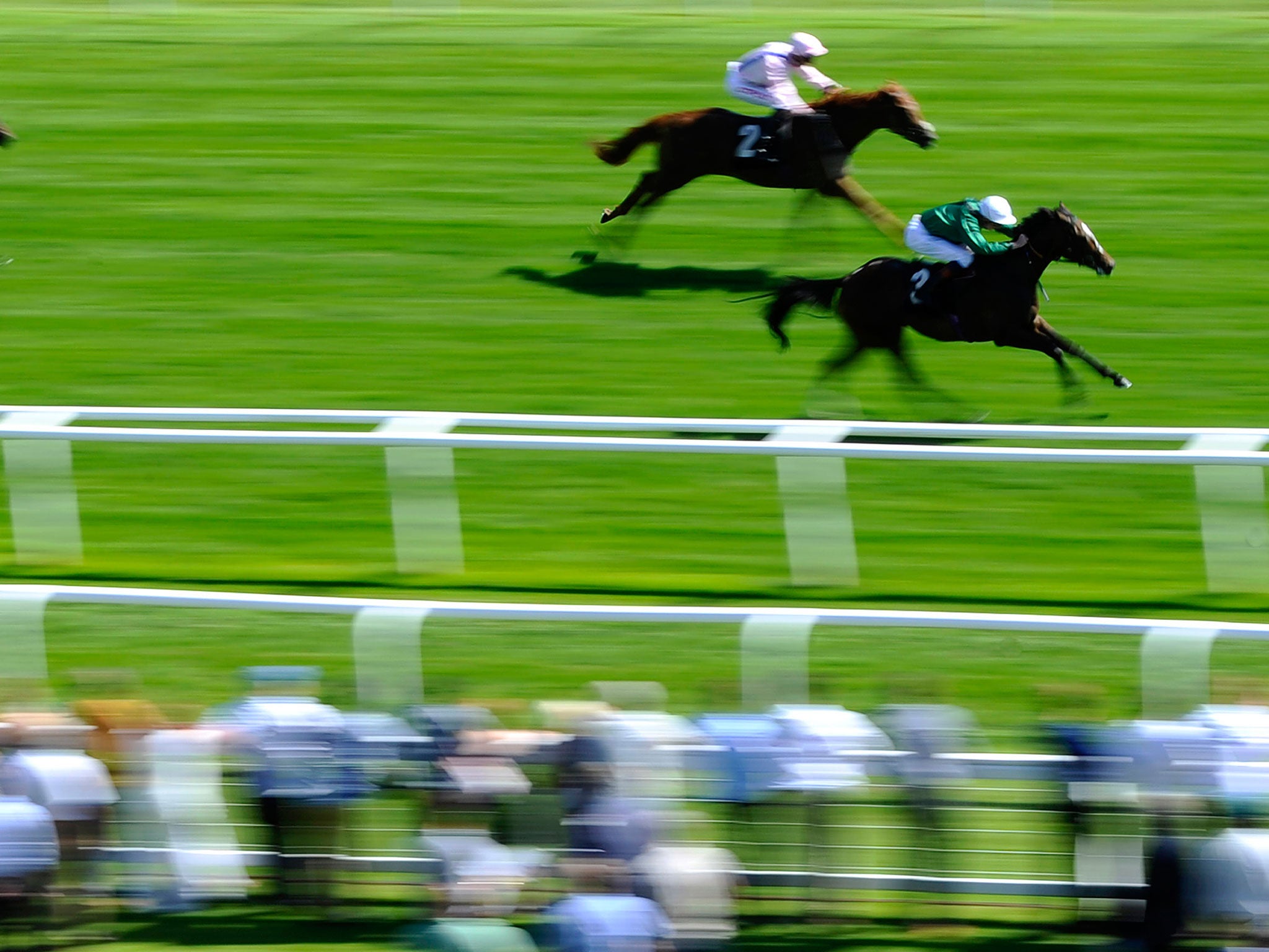 James Doyle riding Limato to win The Rose Bowl Stakes at Newbury racecourse in July 2014