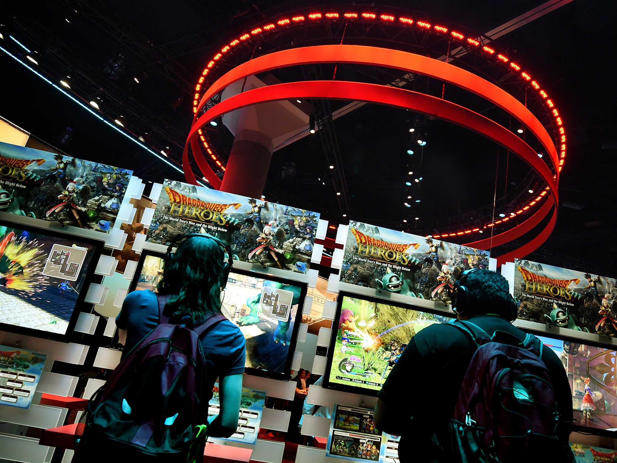 Gamers play Dragon Quest 'Heroes' on the second day of the Electronic Entertainment Expo, known as E3 at the Convention Center in Los Angeles, California on June 17, 2015
