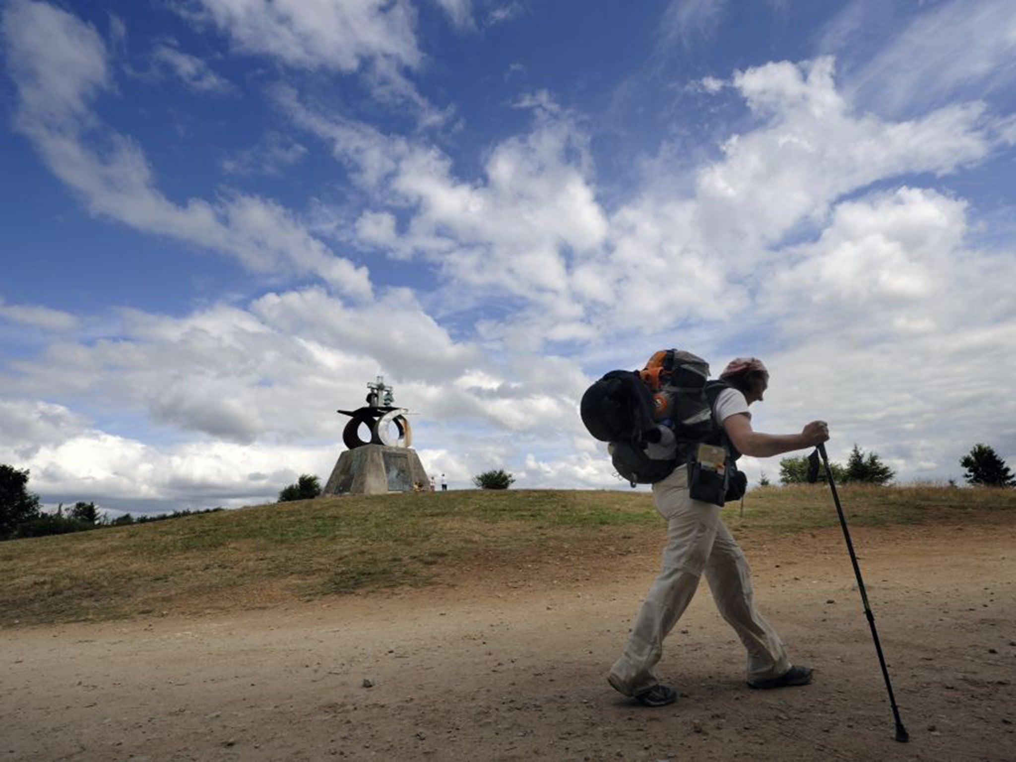 A pilgrim on the Way of Saint James near Monte do Gozo, six miles from the city of Santiago de Compostela, in northern Spain