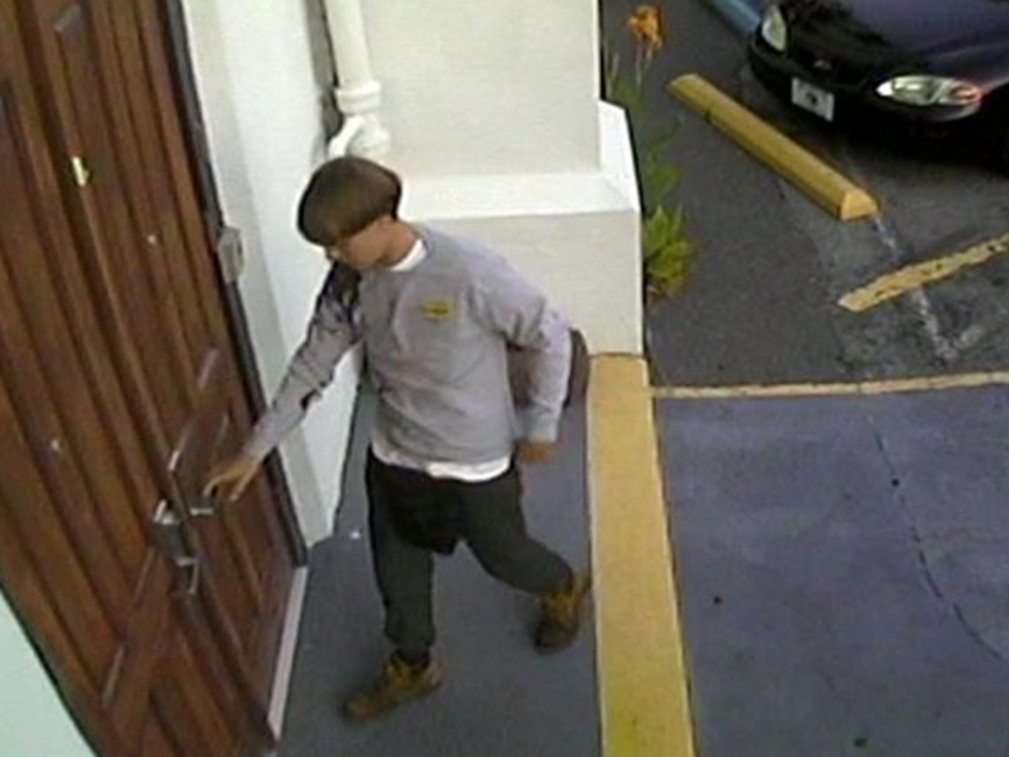 A man believed to be Dylann Roof seen in a CCTV image before the shooting