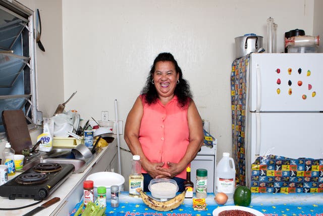 Maria Luz Fedric with the ingredients for her Honduran iguana with rice and beans