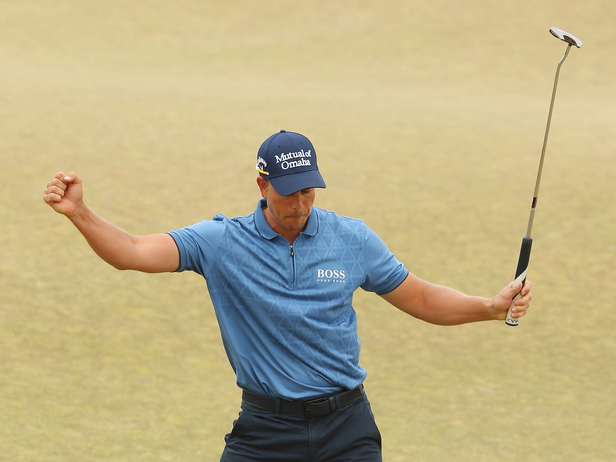 Henrik Stenson celebrates after sinking a 30-foot putt on the 18th