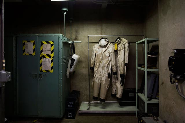 Two rocket fuel handler outfits, which were worn by propellant transfer system technicians, are seen at the Titan Missile Museum, which preserves a Titan II intercontinental ballistic missile, in Sahuarita, Arizona