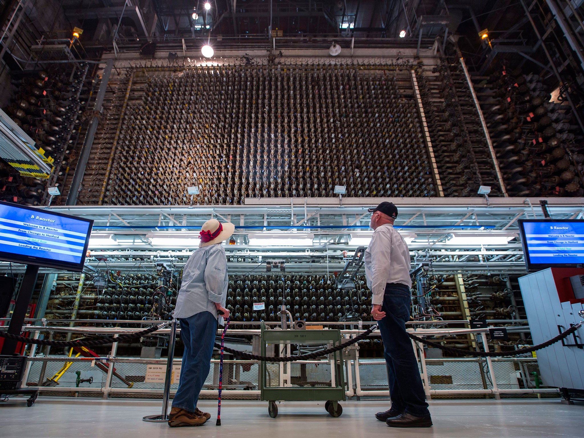 Visitors look at the core of Hanford's historic B Reactor, the world's first, full-scale nuclear reactor, on the Hanford Site in Washington
