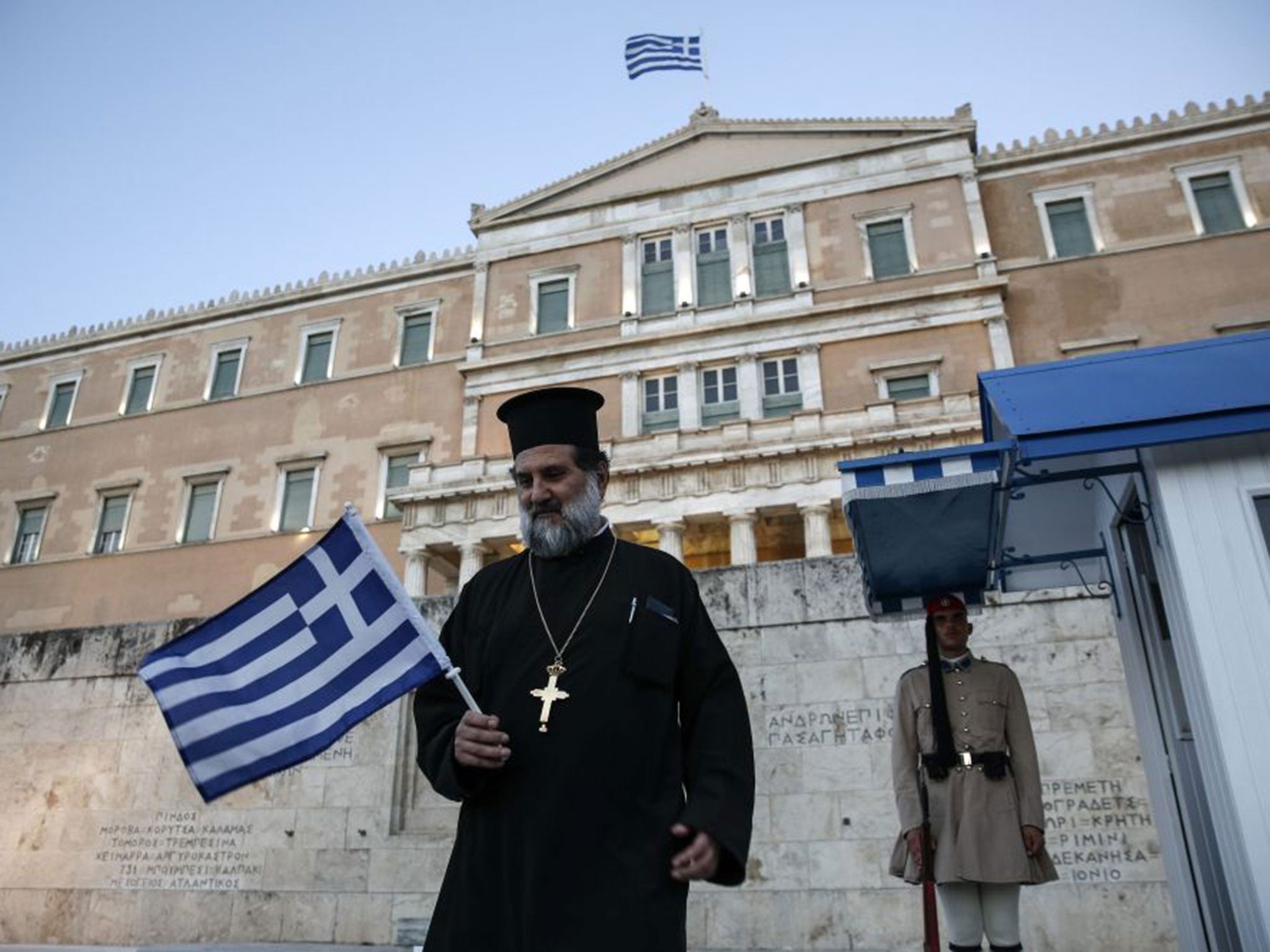 A Greek Orthodox priest during an anti-austerity rally in front of the parliament building in Athens