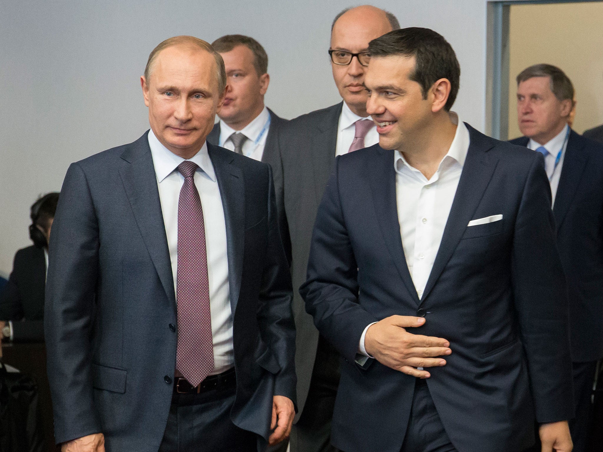 Russian President Vladimir Putin, left, and Greek Prime Minister Alexis Tsipras arrive for their talks at the St. Petersburg International Investment Forum in St.Petersburg, Russia