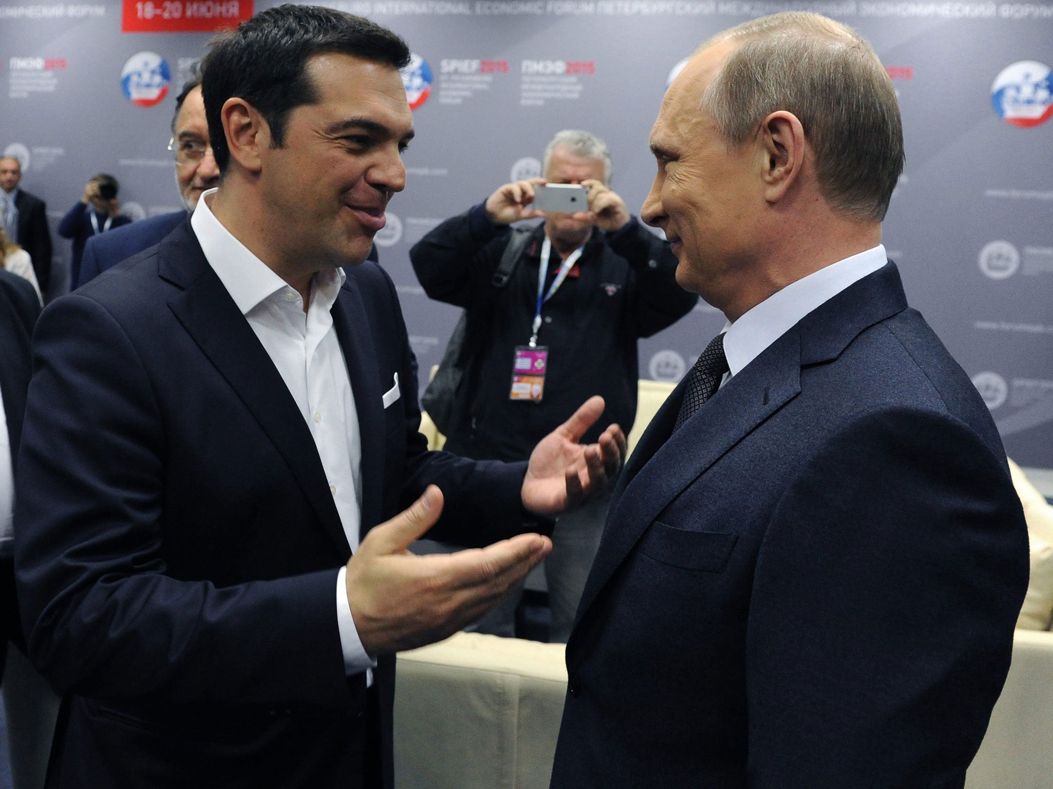 President Vladimir Putin (right) speaks with Greek Prime Minister Alexis Tsipras prior to talks yesterday