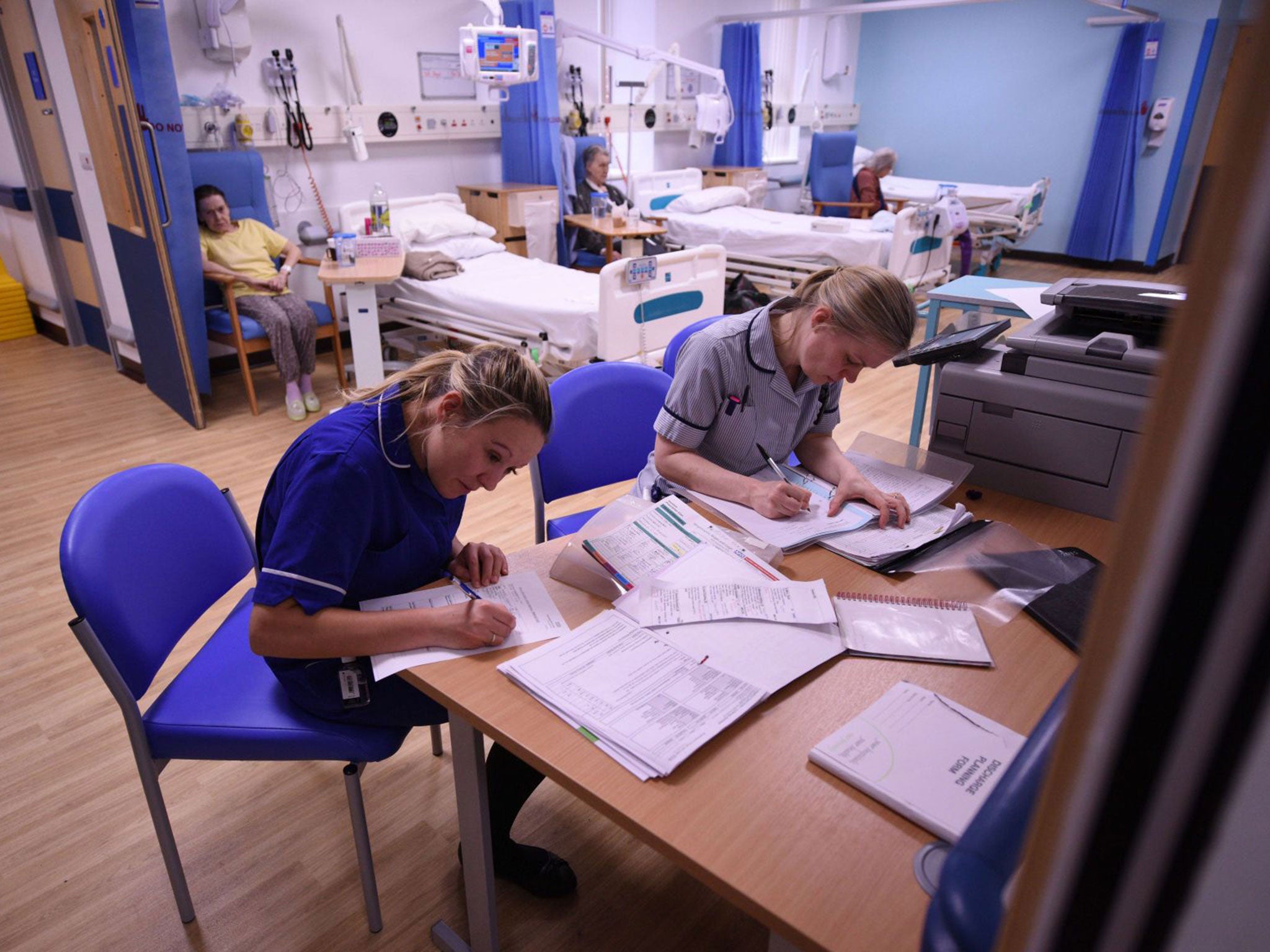 Members of clinical staff complete paperwork in the Accident and Emergency department of the 'Royal Albert Edward Infirmary' in Wigan