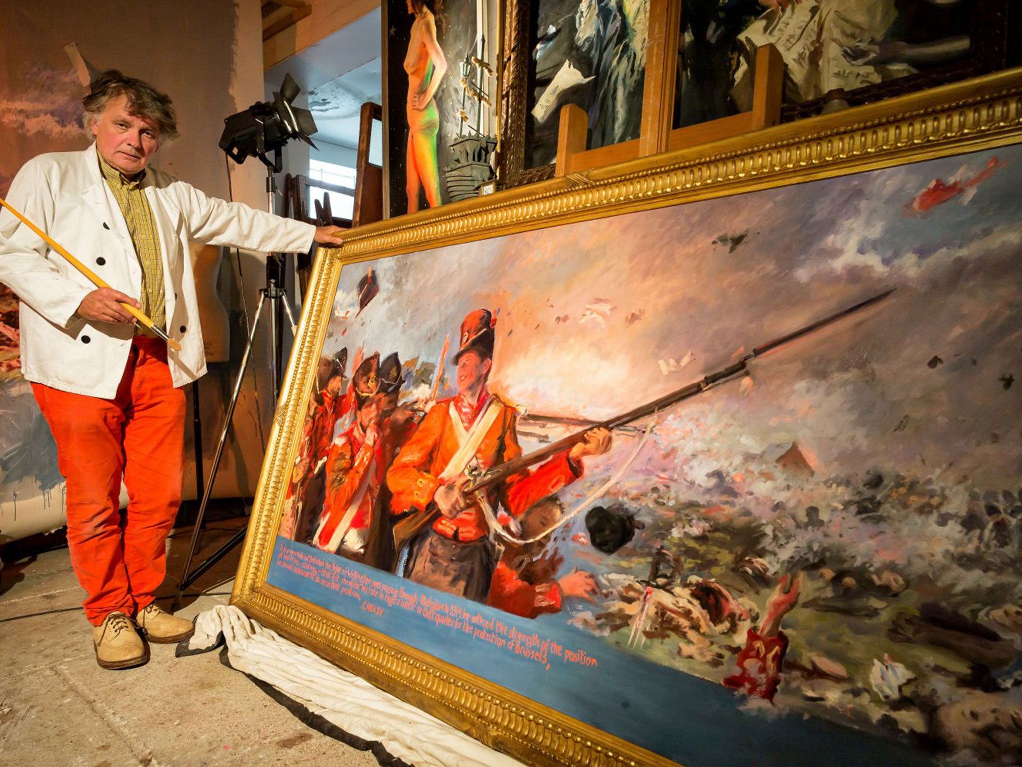 Howard Morgan in his studio, with his official painting for the 200th anniversary of the battle of Waterloo