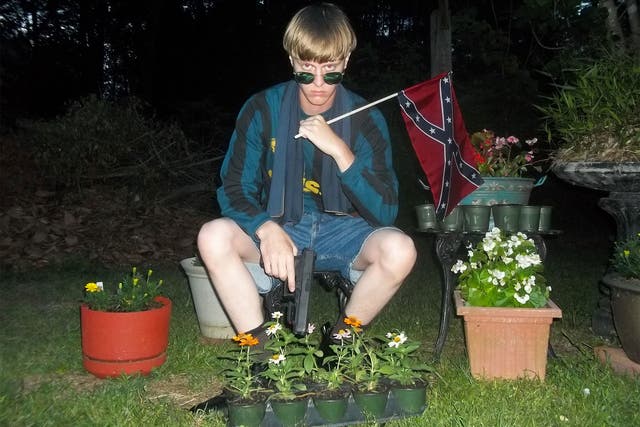 Dylann Roof pictured on the website that also featured a rambling 'manifesto'