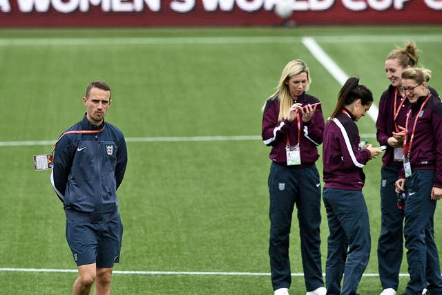 England coach Mark Sampson
with his team in training
