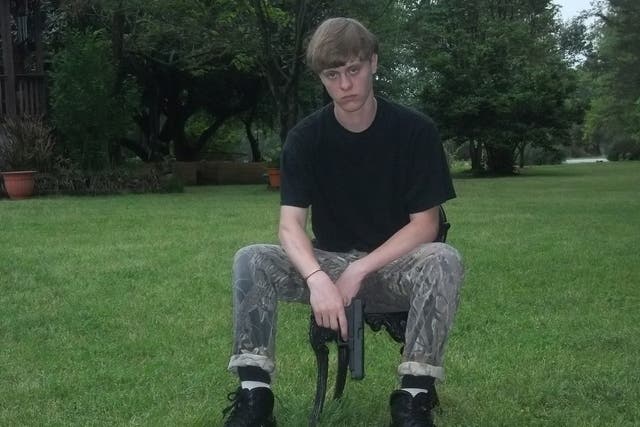 Dylann Storm Roof poses with a gun