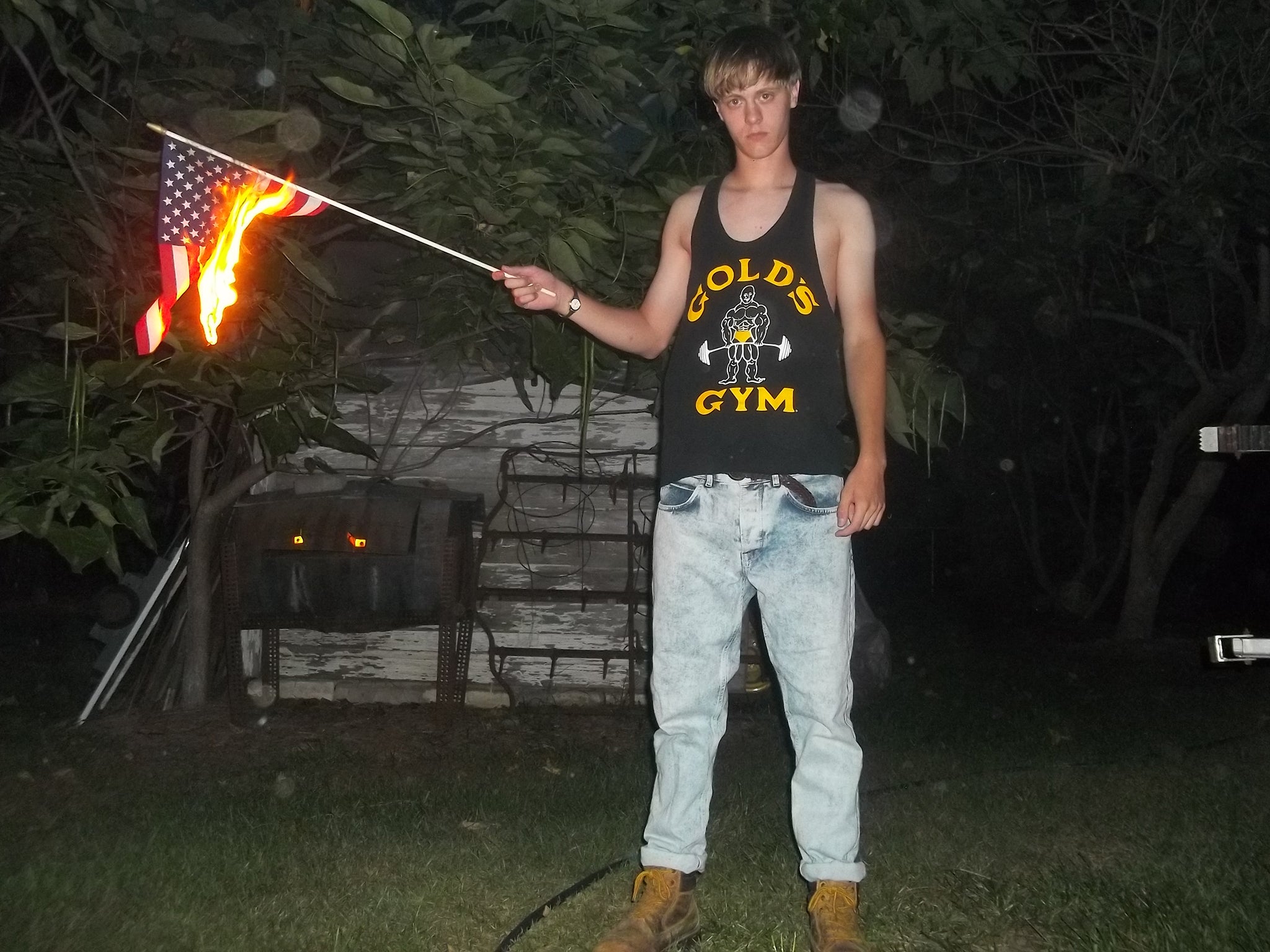 Dylann Storm Roof burning an American flag