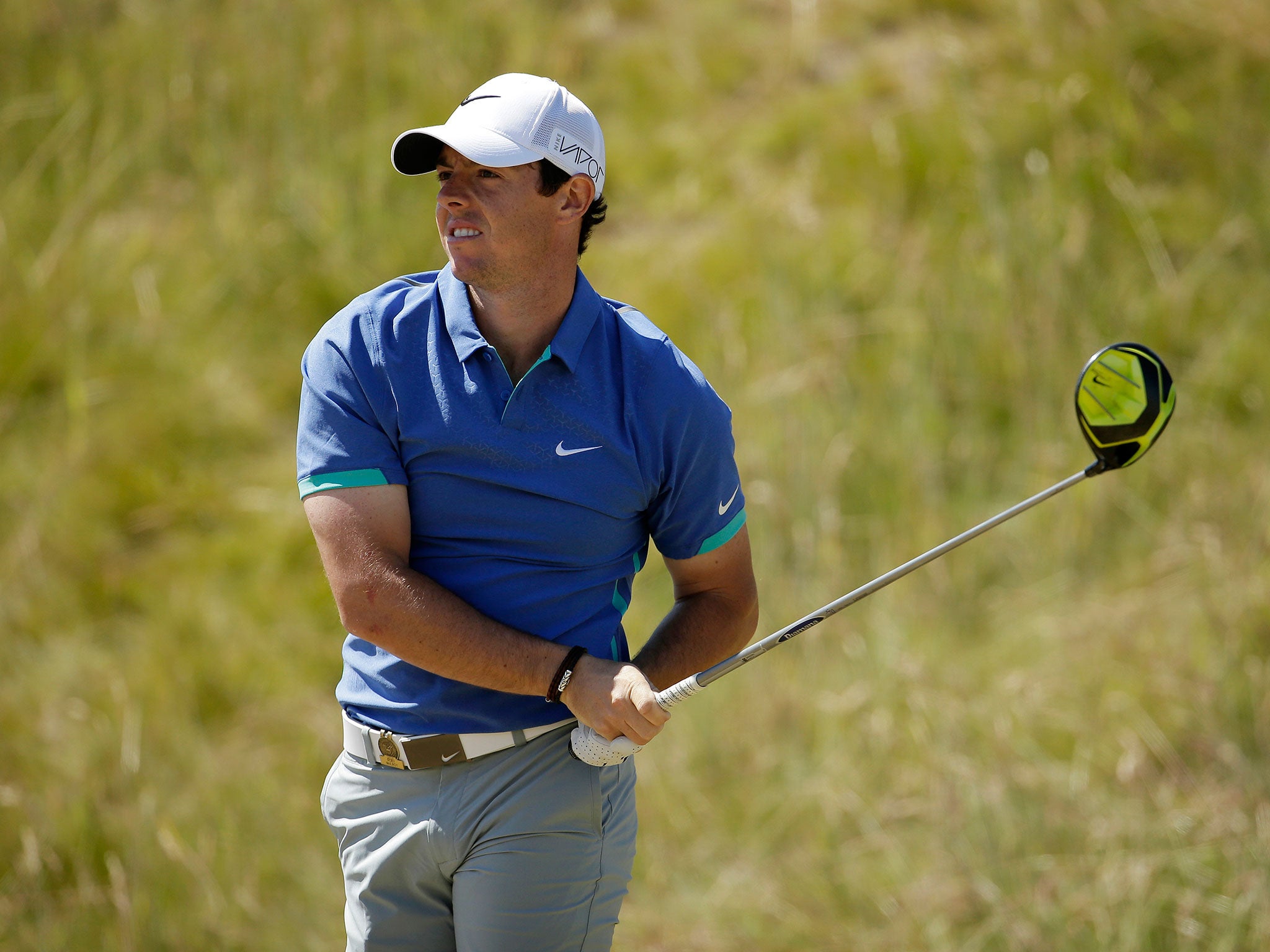 Rory McIlroy, of Northern Ireland, watches his tee shot on the seventh hole during the third round of the U.S. Open