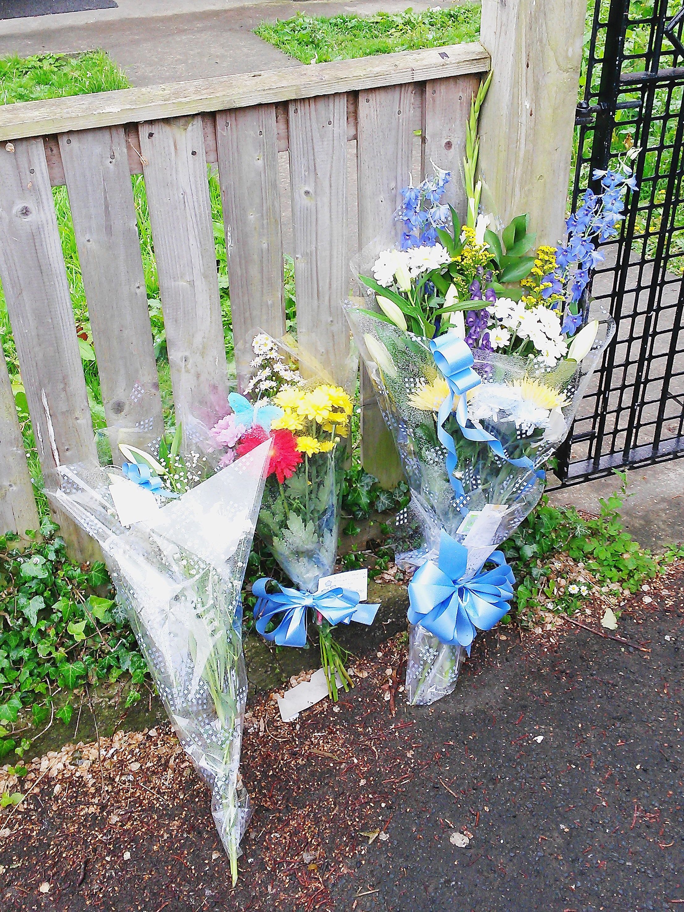 Tributes left to Reggie Blacklin outside the family home (Photo: Dave Higgens/PA Wire)