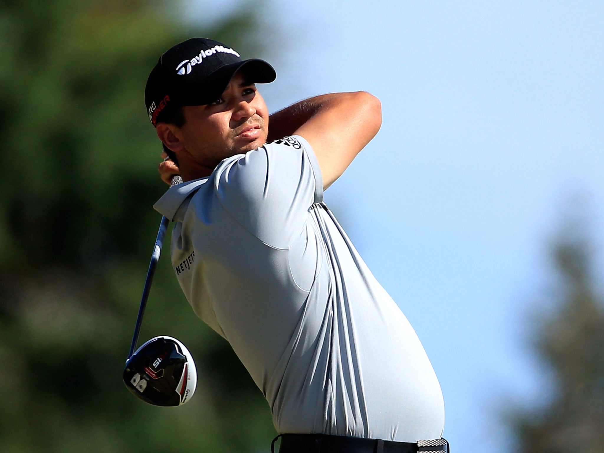 Jason Day hits his tee shot on the 14th hole