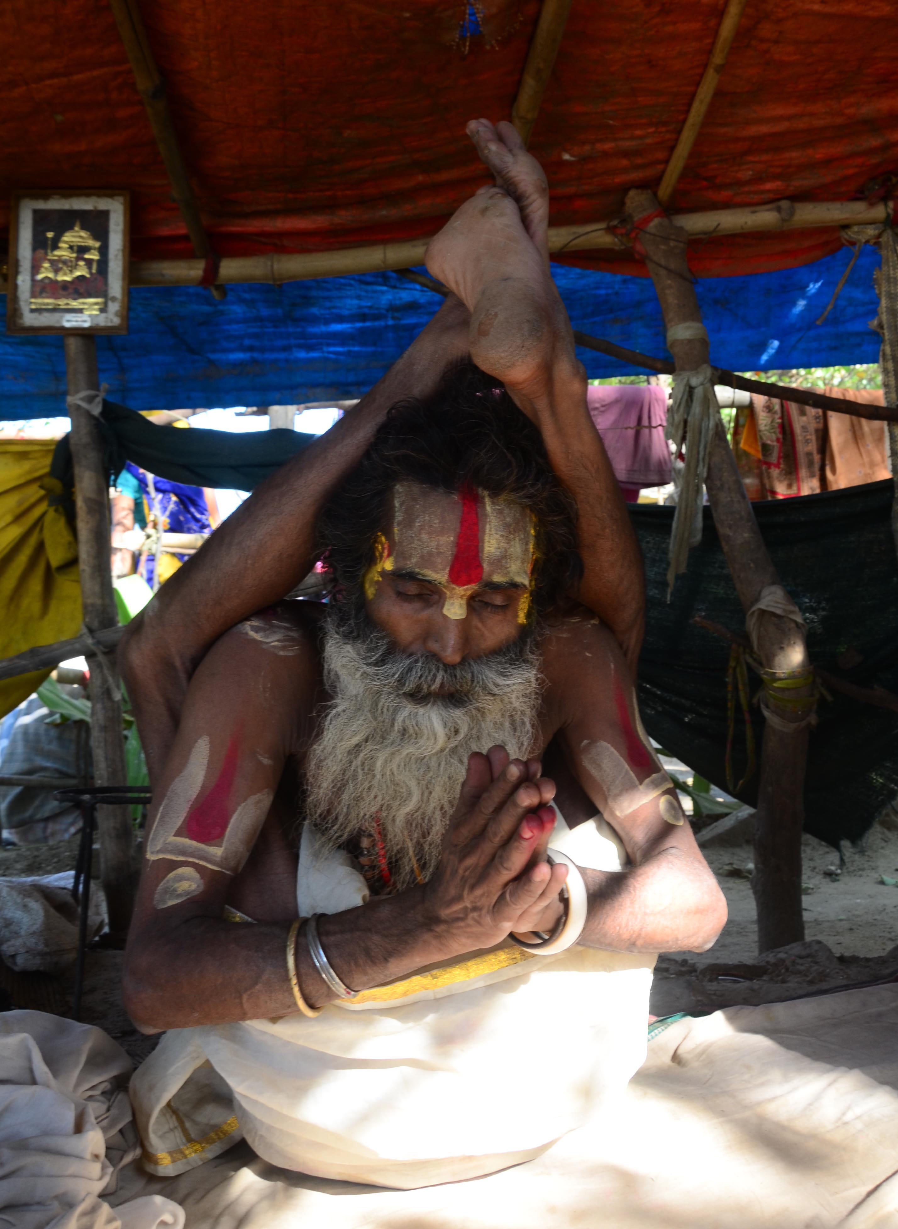 A sadhu performing Yoga to mark today's International Day of Yoga