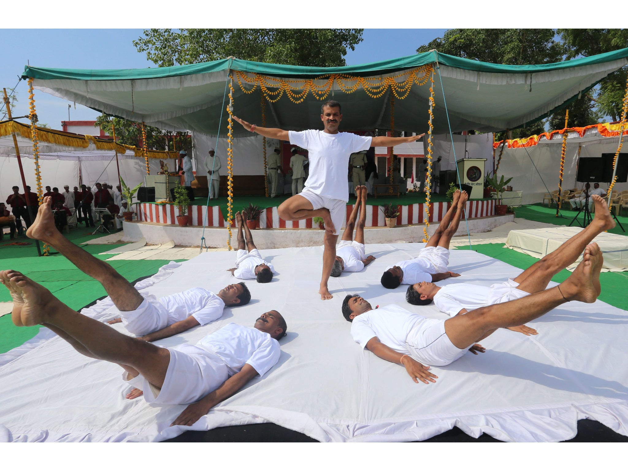 Inmates of Central Jail in Bhopal, India take part in a mass Yoga session today