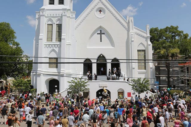 Crowds gather outside the Emanuel African American Methodist Church in Charleston, where nine people were shot dead